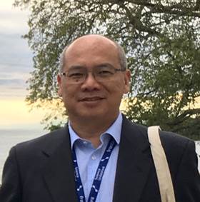 A person wearing a suit and tie

Description automatically generated